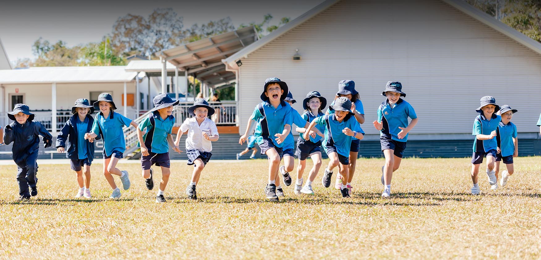 Junior School students running on the oval