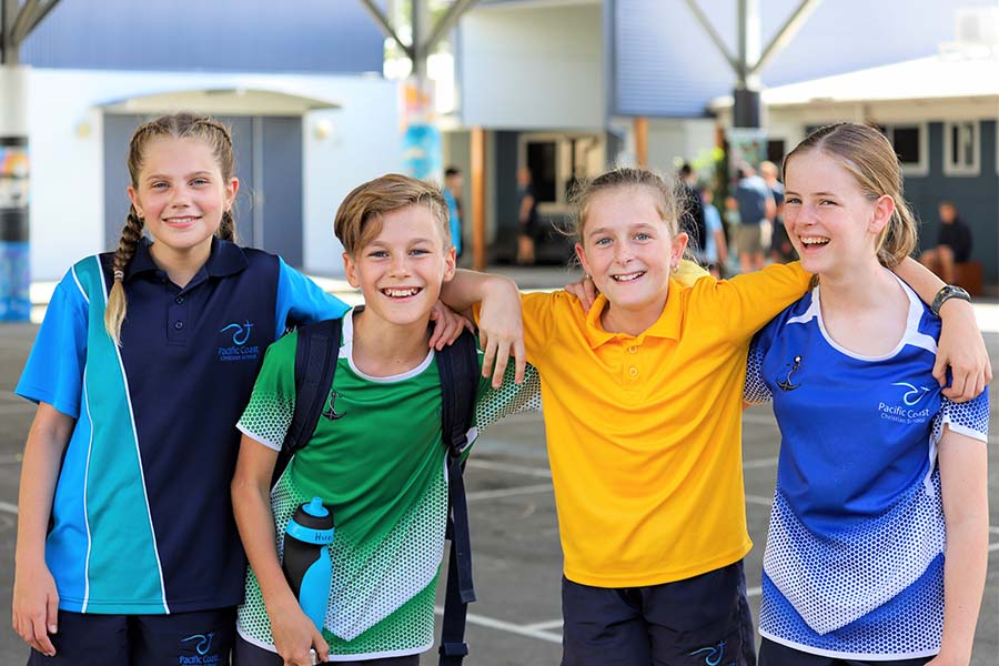 Students wearing various sport uniforms