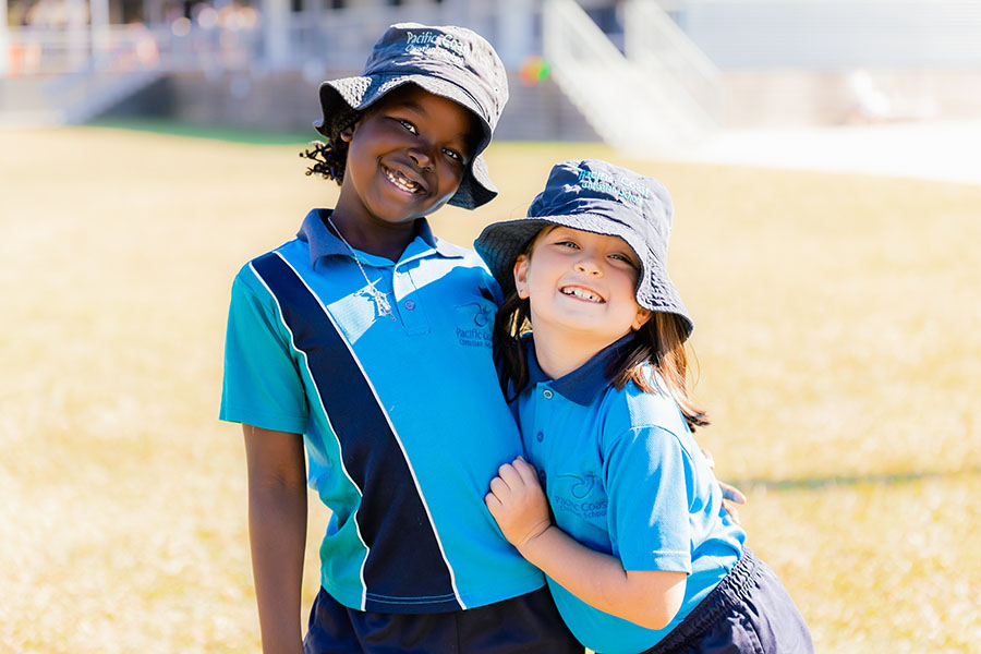 Friends helping to tie their shoe