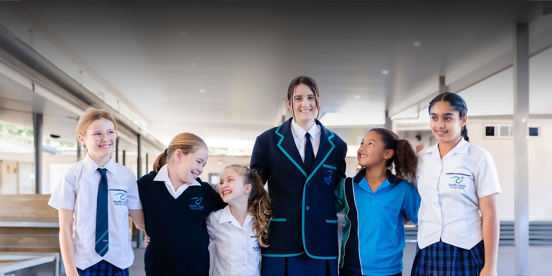 A group of Pacific Coast students walking through the school